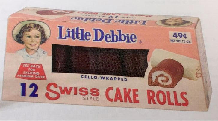 #6: Little Debbie Swiss Rolls #1: Twinkies, #3: Hostess CupCakes, #4: Fruit Roll-Ups, #6: Little Debbie Swiss Rolls, #7: Pudding Cups (Hunt’s or Snack Pack), #9: Peanut Butter and Jelly Sandwich (cut in triangles, what else?), #10: Handi-Snacks (the ones with the red plastic cheese spreader), #12: Marshmallow Pies (Moon Pies), #13: Apple Newtons / Fig Newtons, #15: Planters Cheez Balls (in mini canisters), #16: Zingers, #18: Gushers (late ’80s), #19: Pop-Tarts (in foil wrapper), #21: Capri Sun Pouches, #22: Chewy Granola Bars (Quaker), #24: Chex Mix or Homemade Trail Mix, #25: Butter Cookies (in wax paper), #27: Toaster Pastries (different off-brand Pop-Tarts), #28: Cookies from the School Cafeteria