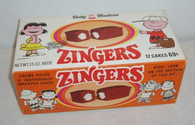 #16: Zingers #1: Twinkies, #3: Hostess CupCakes, #4: Fruit Roll-Ups, #6: Little Debbie Swiss Rolls, #7: Pudding Cups (Hunt’s or Snack Pack), #9: Peanut Butter and Jelly Sandwich (cut in triangles, what else?), #10: Handi-Snacks (the ones with the red plastic cheese spreader), #12: Marshmallow Pies (Moon Pies), #13: Apple Newtons / Fig Newtons, #15: Planters Cheez Balls (in mini canisters), #16: Zingers, #18: Gushers (late ’80s), #19: Pop-Tarts (in foil wrapper), #21: Capri Sun Pouches, #22: Chewy Granola Bars (Quaker), #24: Chex Mix or Homemade Trail Mix, #25: Butter Cookies (in wax paper), #27: Toaster Pastries (different off-brand Pop-Tarts), #28: Cookies from the School Cafeteria