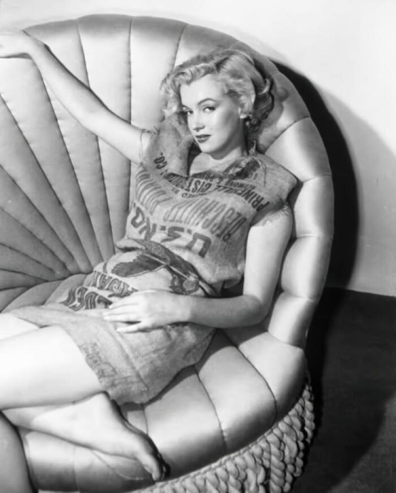 Marilyn Monroe’s Playful Potato Sack Look Royal Dining with Angela Lansbury and Basil Rathbone, Breaking Barriers: Mary Wallace’s Historic Drive, Strength and Heritage in Canyon De Chelly, Portrait of Youth: Kiowa Girl, Berber Beauty: Ouled Nail Girl, A Shared Moment: Paula and Her Kitten, Marilyn Monroe’s Playful Potato Sack Look, Challenging the Rules: Brooklyn Dress Code Protest, 1940, Wolof Family Portrait by Emile Noal, Reunion After a Long Voyage, Elegance in Motion: Manon Chaufour by Martin Imboden, Dad’s Got Moves: Melbourne, 1940s, Fire Escape Embrace, 1946, Ani Chokyi of Tibet, Captured in Darjeeling, 1890s, Headlines and Daydreams, Champs Elysées, 1947, Timeless Athens: The Acropolis in 1860, Catharina ‘Toto’ Koopman: A Parisian Muse, 1933, On the Road Together: Family Hitchhiking, California, Einstein and His Beloved Violin, 1941, Edmund Kesting’s Play with Light and Shadow, 1930, Champagne Inspector in Protective Mask, Helen Bennett’s Stunning Spider Dress, 1939, Harriet Hoctor’s Graceful Question Mark, 1925, Double the Dazzle: The Dolly Sisters in the 1920s, Glamour at The Forbidden City, 1948, Double the Glamour: Mother-Daughter Style, 1954, Cardboard Couture: Sicilian Suit Substitute, The Day Daddy Came Home: Hector Murdoch’s Return, Courage Behind Bars: Mexico, 1935, Milk Time Mischief at Arch Badertscher’s Farm