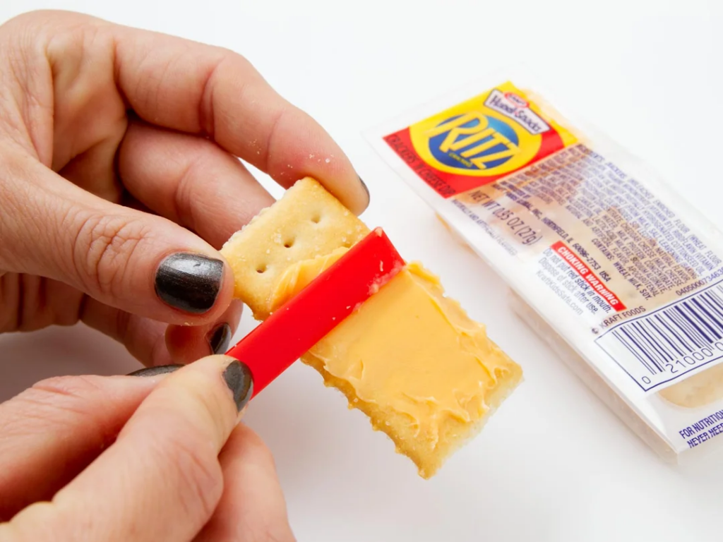 #10: Handi-Snacks (the ones with the red plastic cheese spreader) #1: Twinkies, #3: Hostess CupCakes, #4: Fruit Roll-Ups, #6: Little Debbie Swiss Rolls, #7: Pudding Cups (Hunt’s or Snack Pack), #9: Peanut Butter and Jelly Sandwich (cut in triangles, what else?), #10: Handi-Snacks (the ones with the red plastic cheese spreader), #12: Marshmallow Pies (Moon Pies), #13: Apple Newtons / Fig Newtons, #15: Planters Cheez Balls (in mini canisters), #16: Zingers, #18: Gushers (late ’80s), #19: Pop-Tarts (in foil wrapper), #21: Capri Sun Pouches, #22: Chewy Granola Bars (Quaker), #24: Chex Mix or Homemade Trail Mix, #25: Butter Cookies (in wax paper), #27: Toaster Pastries (different off-brand Pop-Tarts), #28: Cookies from the School Cafeteria