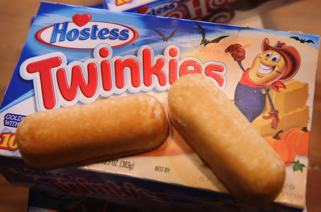 #1: Twinkies #1: Twinkies, #3: Hostess CupCakes, #4: Fruit Roll-Ups, #6: Little Debbie Swiss Rolls, #7: Pudding Cups (Hunt’s or Snack Pack), #9: Peanut Butter and Jelly Sandwich (cut in triangles, what else?), #10: Handi-Snacks (the ones with the red plastic cheese spreader), #12: Marshmallow Pies (Moon Pies), #13: Apple Newtons / Fig Newtons, #15: Planters Cheez Balls (in mini canisters), #16: Zingers, #18: Gushers (late ’80s), #19: Pop-Tarts (in foil wrapper), #21: Capri Sun Pouches, #22: Chewy Granola Bars (Quaker), #24: Chex Mix or Homemade Trail Mix, #25: Butter Cookies (in wax paper), #27: Toaster Pastries (different off-brand Pop-Tarts), #28: Cookies from the School Cafeteria
