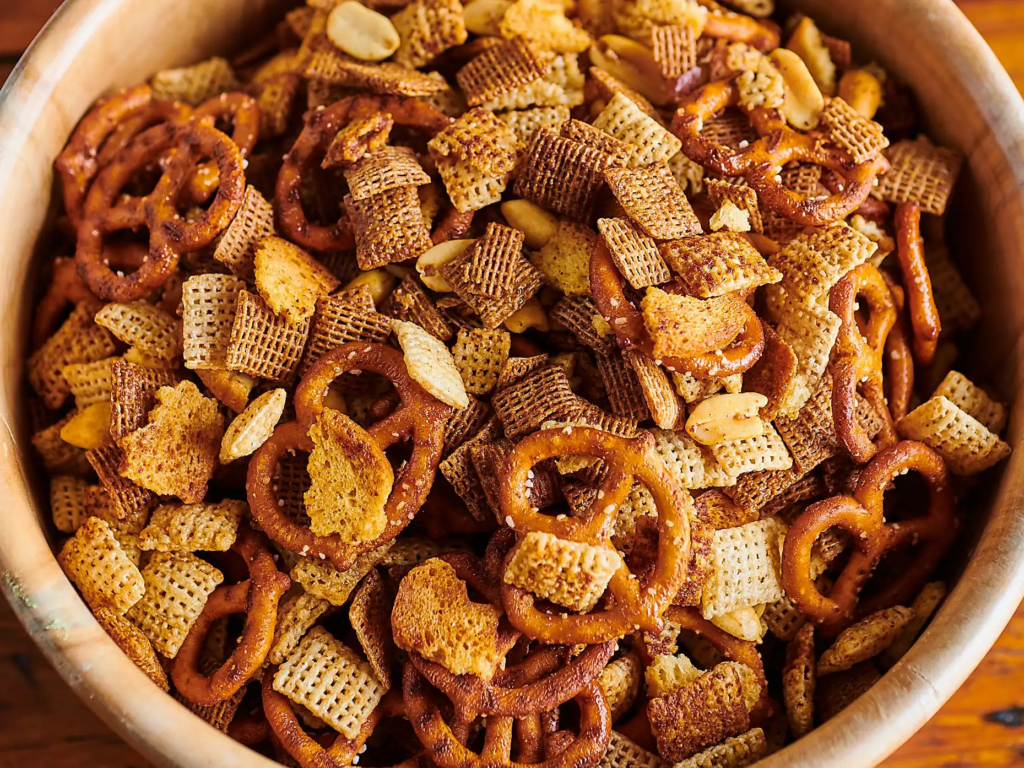 #24: Chex Mix or Homemade Trail Mix #1: Twinkies, #3: Hostess CupCakes, #4: Fruit Roll-Ups, #6: Little Debbie Swiss Rolls, #7: Pudding Cups (Hunt’s or Snack Pack), #9: Peanut Butter and Jelly Sandwich (cut in triangles, what else?), #10: Handi-Snacks (the ones with the red plastic cheese spreader), #12: Marshmallow Pies (Moon Pies), #13: Apple Newtons / Fig Newtons, #15: Planters Cheez Balls (in mini canisters), #16: Zingers, #18: Gushers (late ’80s), #19: Pop-Tarts (in foil wrapper), #21: Capri Sun Pouches, #22: Chewy Granola Bars (Quaker), #24: Chex Mix or Homemade Trail Mix, #25: Butter Cookies (in wax paper), #27: Toaster Pastries (different off-brand Pop-Tarts), #28: Cookies from the School Cafeteria