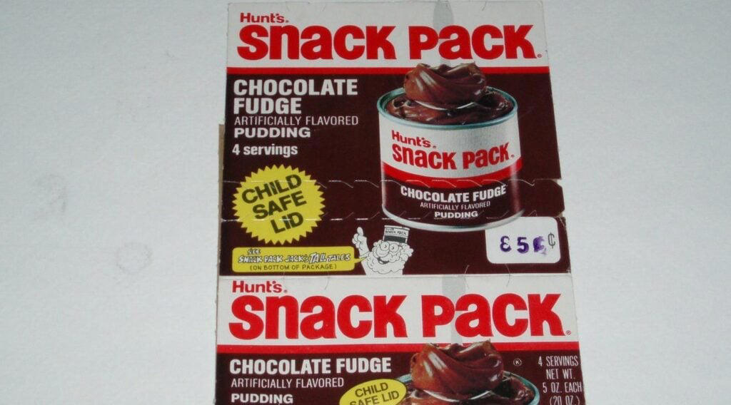 #7: Pudding Cups (Hunt’s or Snack Pack) #1: Twinkies, #3: Hostess CupCakes, #4: Fruit Roll-Ups, #6: Little Debbie Swiss Rolls, #7: Pudding Cups (Hunt’s or Snack Pack), #9: Peanut Butter and Jelly Sandwich (cut in triangles, what else?), #10: Handi-Snacks (the ones with the red plastic cheese spreader), #12: Marshmallow Pies (Moon Pies), #13: Apple Newtons / Fig Newtons, #15: Planters Cheez Balls (in mini canisters), #16: Zingers, #18: Gushers (late ’80s), #19: Pop-Tarts (in foil wrapper), #21: Capri Sun Pouches, #22: Chewy Granola Bars (Quaker), #24: Chex Mix or Homemade Trail Mix, #25: Butter Cookies (in wax paper), #27: Toaster Pastries (different off-brand Pop-Tarts), #28: Cookies from the School Cafeteria