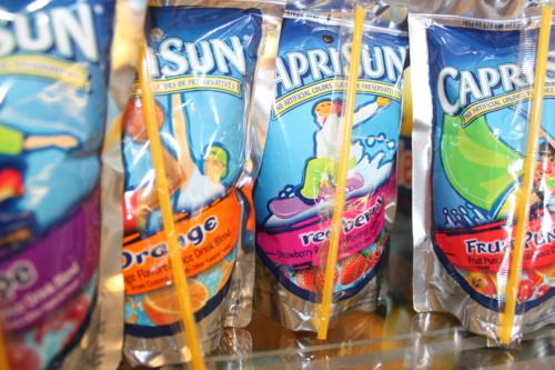 #21: Capri Sun Pouches #1: Twinkies, #3: Hostess CupCakes, #4: Fruit Roll-Ups, #6: Little Debbie Swiss Rolls, #7: Pudding Cups (Hunt’s or Snack Pack), #9: Peanut Butter and Jelly Sandwich (cut in triangles, what else?), #10: Handi-Snacks (the ones with the red plastic cheese spreader), #12: Marshmallow Pies (Moon Pies), #13: Apple Newtons / Fig Newtons, #15: Planters Cheez Balls (in mini canisters), #16: Zingers, #18: Gushers (late ’80s), #19: Pop-Tarts (in foil wrapper), #21: Capri Sun Pouches, #22: Chewy Granola Bars (Quaker), #24: Chex Mix or Homemade Trail Mix, #25: Butter Cookies (in wax paper), #27: Toaster Pastries (different off-brand Pop-Tarts), #28: Cookies from the School Cafeteria