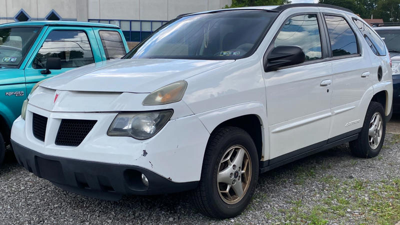 1. Jeep Wrangler (JK), 2. Toyota FJ Cruiser, 3. Ford Explorer (Early 2000s), 4. Suzuki Samurai, 5. Land Rover Defender 90 (Old Gen), 6. Chevrolet Suburban (Pre-2000s), 7. Mitsubishi Montero, 8. Mercedes-Benz G-Class (Pre-2018), 9. Chevrolet Astro Van, 10. Dodge Durango (First Generation), 11. Toyota Land Cruiser (80 Series), 12. Kia Sedona (2000s Models), 13. Nissan Xterra (First Generation), 14. GMC Yukon XL (Early 2000s), 15. Isuzu Trooper, 16. Ford Aerostar, 17. Chrysler Pacifica (First Generation), 18. Hummer H2, 19. Buick Rendezvous, 20. Pontiac Aztek