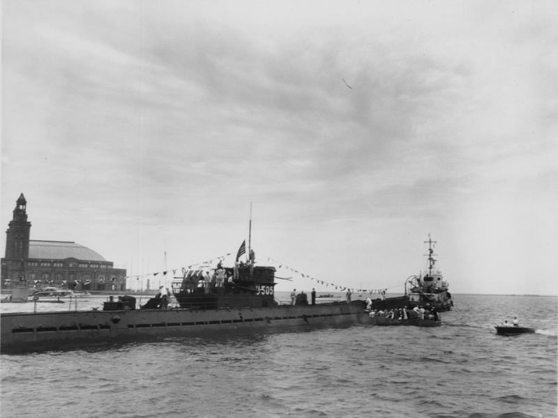 At the end of the tour, I learned how the submarine found its way to Chicago. Bullet holes can be seen all over the conning tower., The first stop on my tour was the petty officer's quarters., When the U-505 was on patrol, it carried 12 tons of food., The crew had to navigate various challenges while underwater, including high temperatures., All calculations before firing a torpedo were done with pen and paper., The US Navy captured the U-505 on June 4, 1944., To prevent the U-505's capture, the Germans tried one last trick., On September 2, 1954, the submarine was hauled across Lake Shore Drive in Chicago., At first, the submarine was displayed outside the museum.
