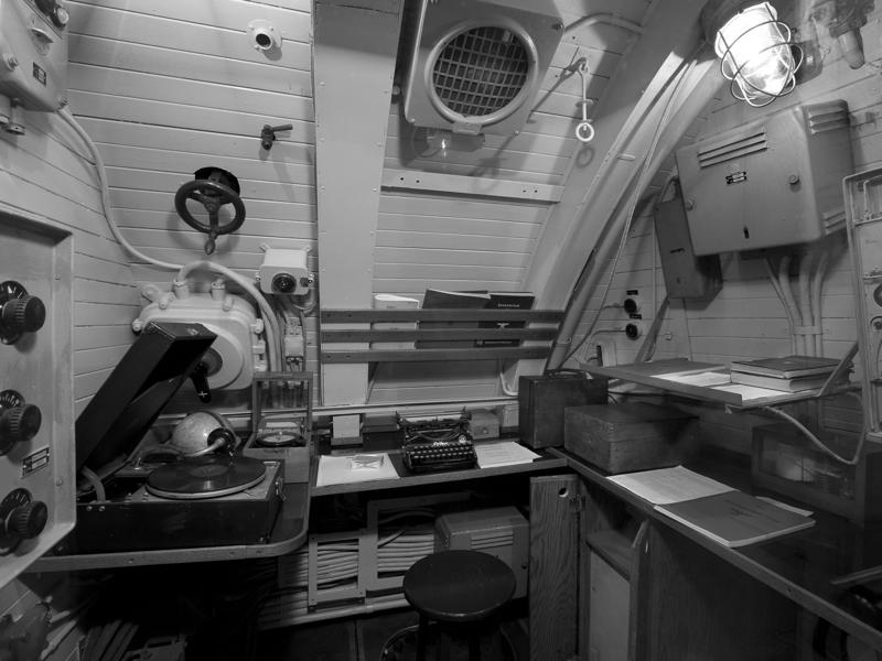 Next, we stopped by the radio room, the U-boat's main connection with the outside world. Bullet holes can be seen all over the conning tower., The first stop on my tour was the petty officer's quarters., When the U-505 was on patrol, it carried 12 tons of food., The crew had to navigate various challenges while underwater, including high temperatures., All calculations before firing a torpedo were done with pen and paper., The US Navy captured the U-505 on June 4, 1944., To prevent the U-505's capture, the Germans tried one last trick., On September 2, 1954, the submarine was hauled across Lake Shore Drive in Chicago., At first, the submarine was displayed outside the museum.