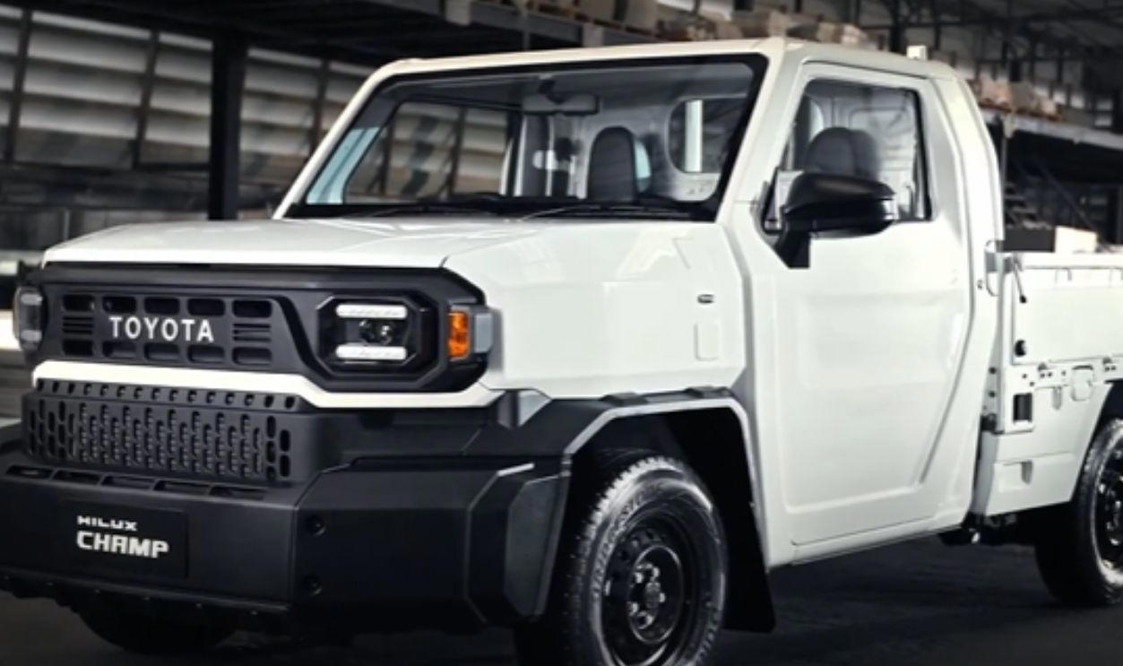 The Champ Has Manual Crank Windows And No Infotainment Whichever Way You Go, There’s A Trade-Off, Its Entry Price Under K Is A Budget Standout, It Comes With Three Engine Options For Every Type Of Driver, The Champ Was Built On Toyota’s Proven IMV Platform, The Bolt-On Body System Enables DIY Configurations, The Champ Is Offered In Two Wheelbase Lengths, It Gets To Work With A 1-Ton Payload, Toyota Gazoo Racing Built A Track Version, Champs’s Optional Diesel Engine Gets Automatic Transmission, The Camper Versions Feature Solar And Hot Water, The Truck Has A Short Turning Radius, The Champ’s Fuel Economy Beats Most US Trucks, The Champ Has Manual Crank Windows And No Infotainment, The Truck Has Basic Safety Features, The Interior Is Designed For Utility, Not Luxury, No US Release Due To Safety And Emissions, Its Flat Deck Comes Standard On The Entry Model, This Model's AC Is Optional, Not Standard, The Trucks’s Custom Add-Ons Often Fall Outside Toyota Support, All Champ Models Use Steel Wheels, It Has Limited Theft Protection Features, The Champ’s Leaf-Spring Suspension Limits Comfort, The Paint And Trim Options Are Minimal