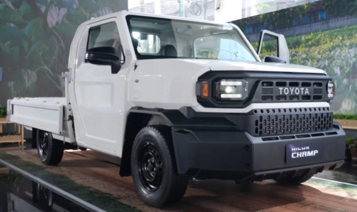 The Bolt-On Body System Enables DIY Configurations Whichever Way You Go, There’s A Trade-Off, Its Entry Price Under K Is A Budget Standout, It Comes With Three Engine Options For Every Type Of Driver, The Champ Was Built On Toyota’s Proven IMV Platform, The Bolt-On Body System Enables DIY Configurations, The Champ Is Offered In Two Wheelbase Lengths, It Gets To Work With A 1-Ton Payload, Toyota Gazoo Racing Built A Track Version, Champs’s Optional Diesel Engine Gets Automatic Transmission, The Camper Versions Feature Solar And Hot Water, The Truck Has A Short Turning Radius, The Champ’s Fuel Economy Beats Most US Trucks, The Champ Has Manual Crank Windows And No Infotainment, The Truck Has Basic Safety Features, The Interior Is Designed For Utility, Not Luxury, No US Release Due To Safety And Emissions, Its Flat Deck Comes Standard On The Entry Model, This Model's AC Is Optional, Not Standard, The Trucks’s Custom Add-Ons Often Fall Outside Toyota Support, All Champ Models Use Steel Wheels, It Has Limited Theft Protection Features, The Champ’s Leaf-Spring Suspension Limits Comfort, The Paint And Trim Options Are Minimal