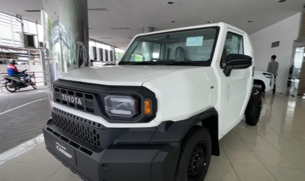This Model's AC Is Optional, Not Standard Whichever Way You Go, There’s A Trade-Off, Its Entry Price Under K Is A Budget Standout, It Comes With Three Engine Options For Every Type Of Driver, The Champ Was Built On Toyota’s Proven IMV Platform, The Bolt-On Body System Enables DIY Configurations, The Champ Is Offered In Two Wheelbase Lengths, It Gets To Work With A 1-Ton Payload, Toyota Gazoo Racing Built A Track Version, Champs’s Optional Diesel Engine Gets Automatic Transmission, The Camper Versions Feature Solar And Hot Water, The Truck Has A Short Turning Radius, The Champ’s Fuel Economy Beats Most US Trucks, The Champ Has Manual Crank Windows And No Infotainment, The Truck Has Basic Safety Features, The Interior Is Designed For Utility, Not Luxury, No US Release Due To Safety And Emissions, Its Flat Deck Comes Standard On The Entry Model, This Model's AC Is Optional, Not Standard, The Trucks’s Custom Add-Ons Often Fall Outside Toyota Support, All Champ Models Use Steel Wheels, It Has Limited Theft Protection Features, The Champ’s Leaf-Spring Suspension Limits Comfort, The Paint And Trim Options Are Minimal