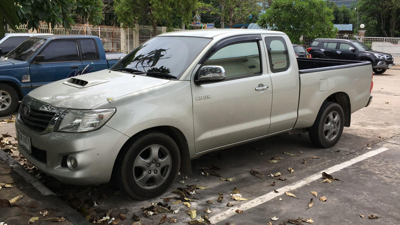 Whichever Way You Go, There’s A Trade-Off, Its Entry Price Under K Is A Budget Standout, It Comes With Three Engine Options For Every Type Of Driver, The Champ Was Built On Toyota’s Proven IMV Platform, The Bolt-On Body System Enables DIY Configurations, The Champ Is Offered In Two Wheelbase Lengths, It Gets To Work With A 1-Ton Payload, Toyota Gazoo Racing Built A Track Version, Champs’s Optional Diesel Engine Gets Automatic Transmission, The Camper Versions Feature Solar And Hot Water, The Truck Has A Short Turning Radius, The Champ’s Fuel Economy Beats Most US Trucks, The Champ Has Manual Crank Windows And No Infotainment, The Truck Has Basic Safety Features, The Interior Is Designed For Utility, Not Luxury, No US Release Due To Safety And Emissions, Its Flat Deck Comes Standard On The Entry Model, This Model's AC Is Optional, Not Standard, The Trucks’s Custom Add-Ons Often Fall Outside Toyota Support, All Champ Models Use Steel Wheels, It Has Limited Theft Protection Features, The Champ’s Leaf-Spring Suspension Limits Comfort, The Paint And Trim Options Are Minimal