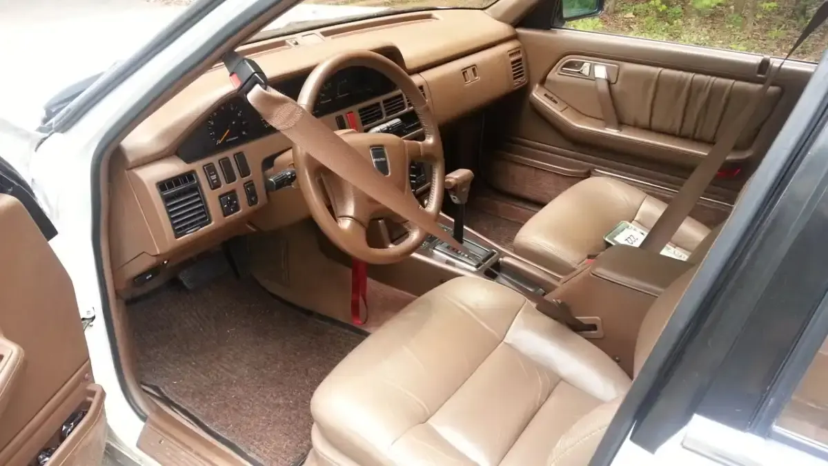 1. Automatic Seat Belts, 2. Car Phones, 3. Pop-Up Headlights, 4. Cigarette Lighters and Ashtrays, 5. Bench Front Seats, 6. Manual Window Cranks, 7. Tape Decks and CD Players, 8. Hood Ornaments, 9. Hidden Gas Caps Behind License Plates