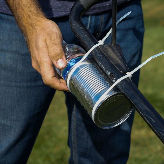 Lawn Mower Grass Chute Saver, Accessorize Your Mower, I-Spy Rain Gutter, Grass Seed Broadcaster, New Use for Old Backyard Game Pieces, Mix Concrete with a Rake, Turn an Empty Milk Jug Into a Watering Can, Long-Handled Tool Rack, Makeshift Trench Tool, Easy Apple Spear, Laundry Jug Watering Can, Tin Can Water Bottle Holder, Vacuum Attachment Holder, Tarp Cement Mixer, Sharpen Your Shovels