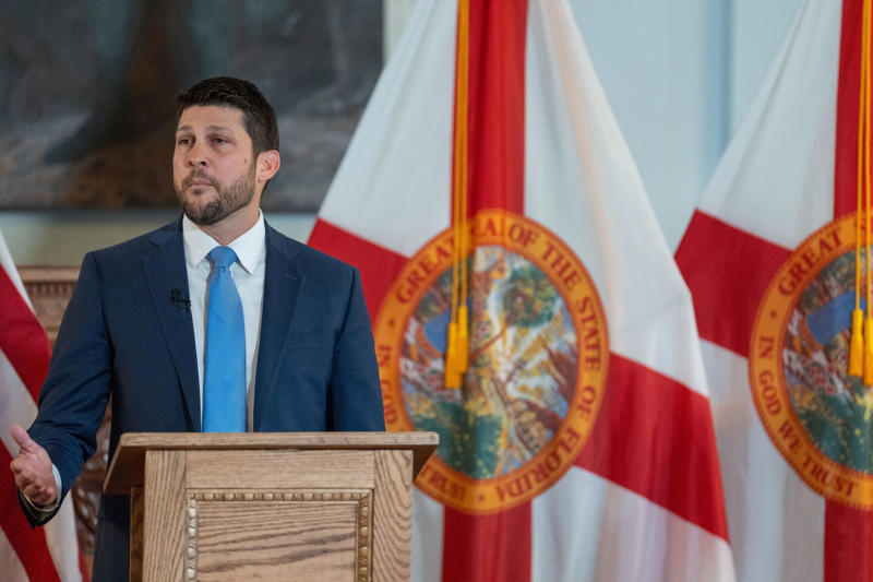 James Uthmeier sworn in as Florida Attorney General, Deputy Alex Mercado honored for public service award, Migrants waiting for U.S. Border Patrol processing, Gov. Ron DeSantis at Red Mass with James Uthmeier, Migrants transported for processing by Border Patrol, Kirsten Bridegan receives Back the Blue Award, James Uthmeier sworn in surrounded by family