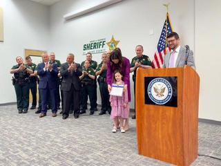 James Uthmeier sworn in as Florida Attorney General, Deputy Alex Mercado honored for public service award, Migrants waiting for U.S. Border Patrol processing, Gov. Ron DeSantis at Red Mass with James Uthmeier, Migrants transported for processing by Border Patrol, Kirsten Bridegan receives Back the Blue Award, James Uthmeier sworn in surrounded by family