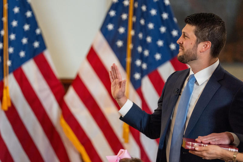James Uthmeier sworn in as Florida Attorney General, Deputy Alex Mercado honored for public service award, Migrants waiting for U.S. Border Patrol processing, Gov. Ron DeSantis at Red Mass with James Uthmeier, Migrants transported for processing by Border Patrol, Kirsten Bridegan receives Back the Blue Award, James Uthmeier sworn in surrounded by family