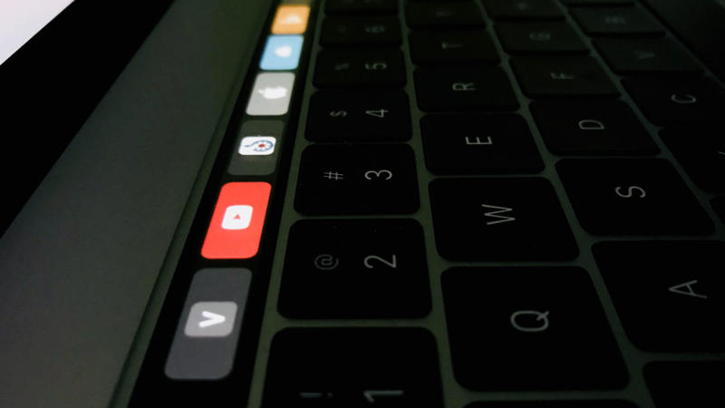 7. The Mac Touch Bar 1. Butterfly Keyboard, 2. Lightning to 3.5 Dongles, 3. iTunes, 4. The Round Mouse, 5. iPod Socks, 6. Charger Cables, 7. The Mac Touch Bar, 8. Magic Mouse, 10. Vision Pro, 1. Mac Mini, 2. iPhone 16, 3. MacBook Pro M4, 4. iMac G3, 5. M4 iPad Pro, 6. Magic Keyboard, 7. AirTag, 8. iPhone 4, 9. iPad 1st Generation, 10. iPod 1st Generation