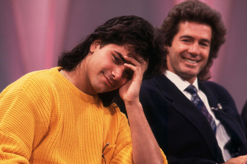 The perm as a cultural identity From hospital idol to universal uncle, The golden age of family television, The perm as a cultural identity, The Stamos effect on nineties masculinity, The return of Uncle Jesse, Stamos off the set, The uncle who doesn’t age (at least publicly), Intergenerational pop icon, The cool uncle as an archetype