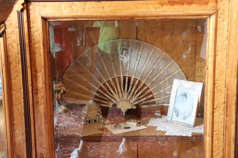 A display case featured Mary Trevor's wedding portrait and a fan she held on her wedding day.
