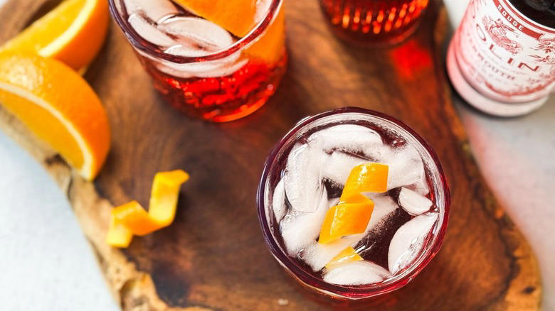 Gather The Classic Americano Cocktail Ingredients, Step 1: Cut An Orange Slice For Garnish, Step 2: Make An Orange Twist, Step 3: Add Ice To A Rocks Glass, Step 4: Add The Campari, Step 5: Follow Up With The Vermouth, Step 6: Top Off With The Club Soda, Step 7: Add An Orange Garnish And Serve, Pairs Well With Classic Americano Cocktails, Classic Americano Cocktail Recipe, What Is The History Of The Negroni And Americano Cocktails?, Read More Recipes