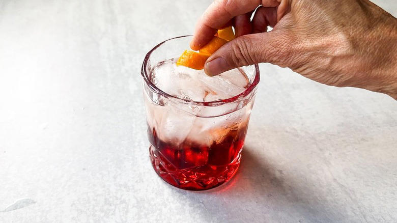 Gather The Classic Americano Cocktail Ingredients, Step 1: Cut An Orange Slice For Garnish, Step 2: Make An Orange Twist, Step 3: Add Ice To A Rocks Glass, Step 4: Add The Campari, Step 5: Follow Up With The Vermouth, Step 6: Top Off With The Club Soda, Step 7: Add An Orange Garnish And Serve, Pairs Well With Classic Americano Cocktails, Classic Americano Cocktail Recipe, What Is The History Of The Negroni And Americano Cocktails?, Read More Recipes