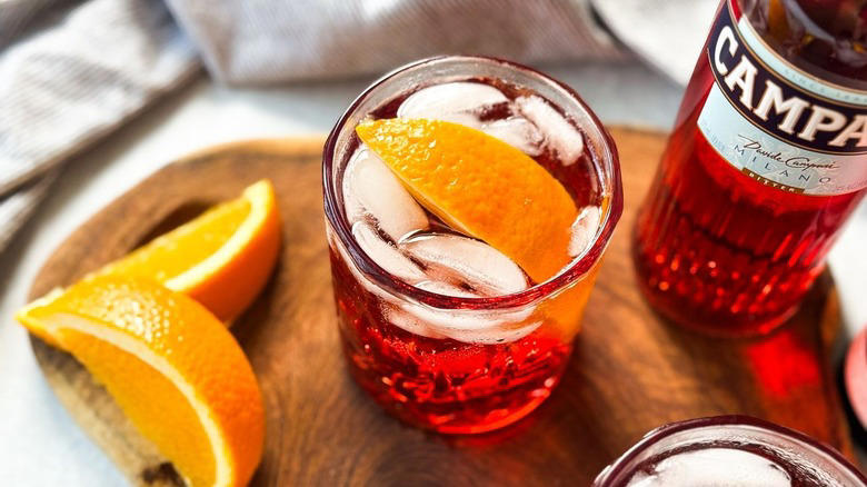 Gather The Classic Americano Cocktail Ingredients, Step 1: Cut An Orange Slice For Garnish, Step 2: Make An Orange Twist, Step 3: Add Ice To A Rocks Glass, Step 4: Add The Campari, Step 5: Follow Up With The Vermouth, Step 6: Top Off With The Club Soda, Step 7: Add An Orange Garnish And Serve, Pairs Well With Classic Americano Cocktails, Classic Americano Cocktail Recipe, What Is The History Of The Negroni And Americano Cocktails?, Read More Recipes