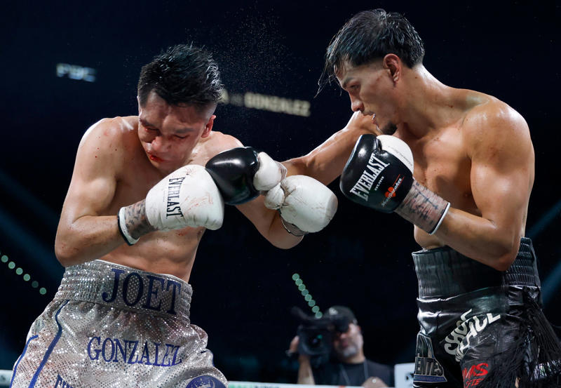 Brandon Figueroa (right) punches Joet Gonzalez during their featherweight bout.