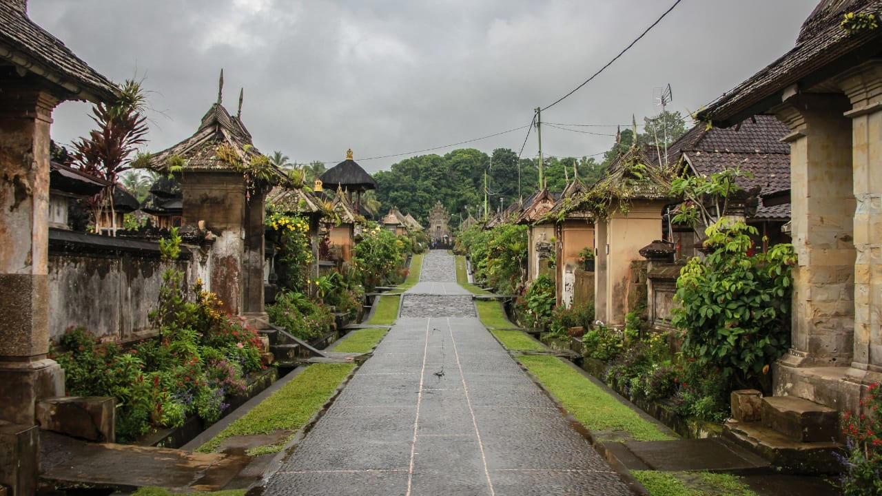 6. Penglipuran Village: Tradition Preserved in Harmony This Balinese Hindu village near Bangli is renowned for its commitment to preserving traditional architecture and customs. The village layout is based on the Tri Mandala concept—spatial zoning rooted in Balinese cosmology. It’s meticulously clean, with manicured gardens and bamboo forests at its edge. Why visit: Witness authentic Balinese culture and community-driven sustainability in action. (Image: Canva) 1. Sidemen Valley: The Soul of Rural Bali Located in East Bali, Sidemen is a lush valley that feels like a time capsule. The region is framed by Mt. Agung, Bali’s sacred volcano, and layered with stunning rice terraces, bamboo forests, and sleepy villages. Hike through the fields, visit traditional weaving centers, or simply relax in a bamboo hut overlooking a river. It’s a favorite among yogis, writers, and slow travelers looking to escape the buzz of Ubud. Why go: Serene landscapes, fewer tourists, great base for cultural immersion and eco-friendly stays. (Image: Canva), 2. Nyang Nyang Beach: Bali’s Untamed Coastline One of the last untouched beaches in South Bali, Nyang Nyang demands effort—around 500 steps down a cliff—but rewards you with solitude, turquoise waves, and dramatic limestone backdrops. You won’t find sunbeds or bars here—just driftwood, wildflowers, and your own patch of sand. Tip: Go early in the morning to avoid the heat and enjoy the beach in silence. (Image: Canva), 3. Sangeh Monkey Forest: Tranquility Amidst Sacred Trees Tucked away in Badung Regency, Sangeh Monkey Forest is older and quieter than its more famous cousin in Ubud. The forest is home to towering nutmeg trees, Balinese temples, and a well-behaved tribe of macaques known for their less aggressive nature. It’s perfect for a quiet cultural detour. Insider fact: Locals believe the trees in the forest are sacred and spiritually protected. (Image: Canva), 4. Amed: A Diver’s Hideaway with a Laid-Back Vibe Amed’s coastline is worlds apart from Seminyak’s glitz. With its volcanic black-sand beaches, traditional jukung boats bobbing in the water, and easy access to coral reefs and WWII shipwrecks, it’s a paradise for snorkelers and divers. The pace is slow, the people warm, and the sunsets unforgettable. Don’t miss: Sunrise views of Mount Agung and a day trip to the Japanese shipwreck in Lipah Beach. (Image: Canva), 5. Munduk: Bali’s Misty Mountain Escape Set high in Bali’s northern highlands, Munduk is a tranquil village surrounded by coffee plantations, waterfalls, and dense forests. Cooler temperatures and misty mornings create a refreshing contrast to the island’s coast, inviting visitors to explore hiking trails and traditional villages far from the tourist bustle. Why it’s special: A peaceful retreat for nature lovers and trekkers seeking unspoiled landscapes and authentic local culture. (Image: Canva), 6. Penglipuran Village: Tradition Preserved in Harmony This Balinese Hindu village near Bangli is renowned for its commitment to preserving traditional architecture and customs. The village layout is based on the Tri Mandala concept—spatial zoning rooted in Balinese cosmology. It’s meticulously clean, with manicured gardens and bamboo forests at its edge. Why visit: Witness authentic Balinese culture and community-driven sustainability in action. (Image: Canva), 7. Banyu Wana Amertha Waterfall: A Hidden Natural Wonder Tucked away in the lush hills of Buleleng, this collection of waterfalls is lesser-known but absolutely spectacular. Multiple falls cascade through the jungle, offering secluded swimming spots and stunning photo opportunities. A short trek through flower farms and coffee plantations adds charm to the journey. Pro tip: Wear water shoes and bring a picnic for a truly immersive nature escape. (Image: Canva), 8. Menjangan Island: Bali’s Best Snorkeling Without the Crowds Situated in West Bali National Park, Menjangan Island is part of a protected marine reserve. The water clarity is exceptional, with vibrant coral walls, reef fish, and occasional sightings of reef sharks or turtles. On land, the island is home to wild deer that roam freely. Good to know: Access is by boat from Labuan Lalang; guided snorkel or dive trips can be arranged locally. (Image: Canva), 9. Pura Beji Sangsit: A Hidden Temple of Intricate Carvings Located in the village of Sangsit in North Bali, Pura Beji is a serene temple famed for its elaborate stone carvings and unique architectural style. Unlike the bustling temples near Ubud, it offers a peaceful atmosphere where visitors can appreciate Bali’s rich artistic heritage in quiet contemplation. What makes it unique: The temple’s detailed decorations and tranquil setting provide a glimpse into traditional Balinese craftsmanship away from tourist crowds. (Image: Canva)
