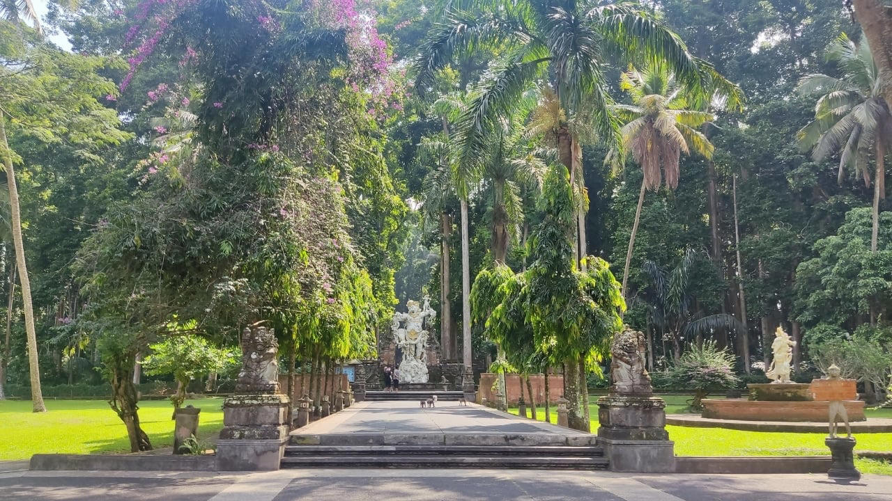 3. Sangeh Monkey Forest: Tranquility Amidst Sacred Trees Tucked away in Badung Regency, Sangeh Monkey Forest is older and quieter than its more famous cousin in Ubud. The forest is home to towering nutmeg trees, Balinese temples, and a well-behaved tribe of macaques known for their less aggressive nature. It’s perfect for a quiet cultural detour. Insider fact: Locals believe the trees in the forest are sacred and spiritually protected. (Image: Canva) 1. Sidemen Valley: The Soul of Rural Bali Located in East Bali, Sidemen is a lush valley that feels like a time capsule. The region is framed by Mt. Agung, Bali’s sacred volcano, and layered with stunning rice terraces, bamboo forests, and sleepy villages. Hike through the fields, visit traditional weaving centers, or simply relax in a bamboo hut overlooking a river. It’s a favorite among yogis, writers, and slow travelers looking to escape the buzz of Ubud. Why go: Serene landscapes, fewer tourists, great base for cultural immersion and eco-friendly stays. (Image: Canva), 2. Nyang Nyang Beach: Bali’s Untamed Coastline One of the last untouched beaches in South Bali, Nyang Nyang demands effort—around 500 steps down a cliff—but rewards you with solitude, turquoise waves, and dramatic limestone backdrops. You won’t find sunbeds or bars here—just driftwood, wildflowers, and your own patch of sand. Tip: Go early in the morning to avoid the heat and enjoy the beach in silence. (Image: Canva), 3. Sangeh Monkey Forest: Tranquility Amidst Sacred Trees Tucked away in Badung Regency, Sangeh Monkey Forest is older and quieter than its more famous cousin in Ubud. The forest is home to towering nutmeg trees, Balinese temples, and a well-behaved tribe of macaques known for their less aggressive nature. It’s perfect for a quiet cultural detour. Insider fact: Locals believe the trees in the forest are sacred and spiritually protected. (Image: Canva), 4. Amed: A Diver’s Hideaway with a Laid-Back Vibe Amed’s coastline is worlds apart from Seminyak’s glitz. With its volcanic black-sand beaches, traditional jukung boats bobbing in the water, and easy access to coral reefs and WWII shipwrecks, it’s a paradise for snorkelers and divers. The pace is slow, the people warm, and the sunsets unforgettable. Don’t miss: Sunrise views of Mount Agung and a day trip to the Japanese shipwreck in Lipah Beach. (Image: Canva), 5. Munduk: Bali’s Misty Mountain Escape Set high in Bali’s northern highlands, Munduk is a tranquil village surrounded by coffee plantations, waterfalls, and dense forests. Cooler temperatures and misty mornings create a refreshing contrast to the island’s coast, inviting visitors to explore hiking trails and traditional villages far from the tourist bustle. Why it’s special: A peaceful retreat for nature lovers and trekkers seeking unspoiled landscapes and authentic local culture. (Image: Canva), 6. Penglipuran Village: Tradition Preserved in Harmony This Balinese Hindu village near Bangli is renowned for its commitment to preserving traditional architecture and customs. The village layout is based on the Tri Mandala concept—spatial zoning rooted in Balinese cosmology. It’s meticulously clean, with manicured gardens and bamboo forests at its edge. Why visit: Witness authentic Balinese culture and community-driven sustainability in action. (Image: Canva), 7. Banyu Wana Amertha Waterfall: A Hidden Natural Wonder Tucked away in the lush hills of Buleleng, this collection of waterfalls is lesser-known but absolutely spectacular. Multiple falls cascade through the jungle, offering secluded swimming spots and stunning photo opportunities. A short trek through flower farms and coffee plantations adds charm to the journey. Pro tip: Wear water shoes and bring a picnic for a truly immersive nature escape. (Image: Canva), 8. Menjangan Island: Bali’s Best Snorkeling Without the Crowds Situated in West Bali National Park, Menjangan Island is part of a protected marine reserve. The water clarity is exceptional, with vibrant coral walls, reef fish, and occasional sightings of reef sharks or turtles. On land, the island is home to wild deer that roam freely. Good to know: Access is by boat from Labuan Lalang; guided snorkel or dive trips can be arranged locally. (Image: Canva), 9. Pura Beji Sangsit: A Hidden Temple of Intricate Carvings Located in the village of Sangsit in North Bali, Pura Beji is a serene temple famed for its elaborate stone carvings and unique architectural style. Unlike the bustling temples near Ubud, it offers a peaceful atmosphere where visitors can appreciate Bali’s rich artistic heritage in quiet contemplation. What makes it unique: The temple’s detailed decorations and tranquil setting provide a glimpse into traditional Balinese craftsmanship away from tourist crowds. (Image: Canva)