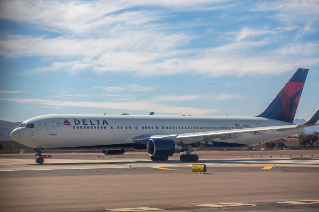 Engine of Boeing passenger plane bursts into flames during take-off