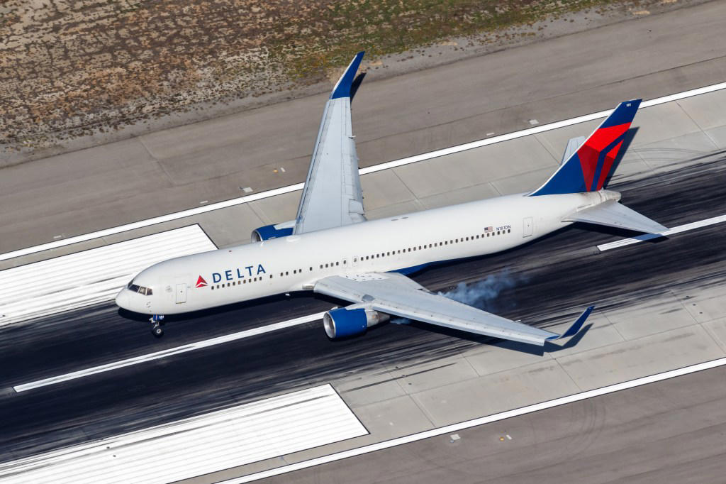 Engine of Boeing passenger plane bursts into flames during take-off