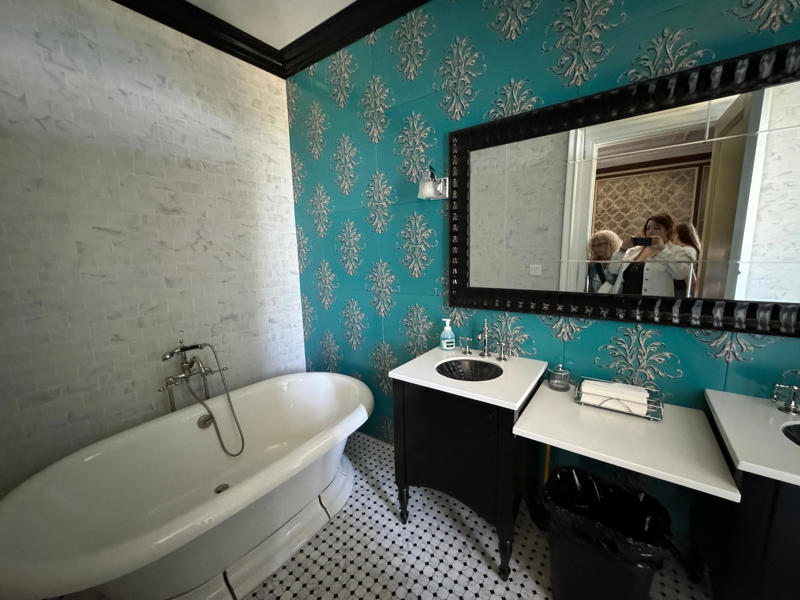 It's also one of the only rooms with a private bathroom. It also features the largest fireplace in the home., The billiards room also has a luxurious window seat., Directly next to the breakfast room was another wood-paneled study., It has yet another perfect window seat., It's also one of the only rooms with a private bathroom., We stopped at one more guest room, which was more modest., As the tour concluded, we were able to explore the gardens outside.