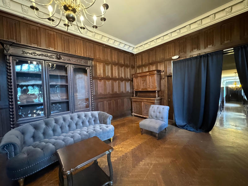 Directly next to the breakfast room was another wood-paneled study. It also features the largest fireplace in the home., The billiards room also has a luxurious window seat., Directly next to the breakfast room was another wood-paneled study., It has yet another perfect window seat., It's also one of the only rooms with a private bathroom., We stopped at one more guest room, which was more modest., As the tour concluded, we were able to explore the gardens outside.
