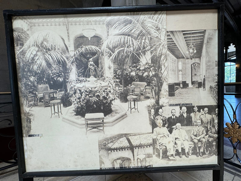Here's what the Palm Court looked like 100 years ago. In the bottom-right photo, the Guggenheims are pictured with Charles Lindbergh and one of the Wright brothers. It also features the largest fireplace in the home., The billiards room also has a luxurious window seat., Directly next to the breakfast room was another wood-paneled study., It has yet another perfect window seat., It's also one of the only rooms with a private bathroom., We stopped at one more guest room, which was more modest., As the tour concluded, we were able to explore the gardens outside.