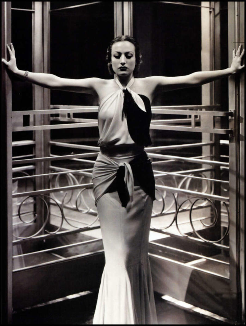 4. Joan Crawford, 1932 1. A World War Veteran, 1932, 2. Jean Bugatti standing next to his Bugatti Royale, one of the seven he built, 1932, 3. This milkmaid is trying to get the pig off the road, Norway, 1932, 4. Joan Crawford, 1932, 5. Just a young girl and her dog, 1932, 6. Taking a break after their tennis match, Washington DC, 1932, 7. Charles Ebbets shooting his famous photo, Lunch atop a Skyscraper, 1932, 8. Rocking the fur coats and a Cadillac in Harlem, 1932, 9. Painting the Eiffel Tower in 1932, 10. Sitting in peace in NYC, 1932, 11. Driving a dynasphere, 1932, 12. Harpo Marx and Amelia Earhart on the set of Horse Feathers, 1932, 13. Jacob Rheuben Ehrlich (8 ft 6 in) walking the Chicago streets with kids, 1932, 14. Sitting on a truck, playing her guitar in Amarillo, Texas, 1932, 15. A family portrait in Poland, 1932, 16. A colorized portrait of Amelia Earhart, 1932, 17. A woman bringing her pet cat to have a cup of tea, 18. Charles C. Ebbets snapping photos on a skyscraper, 1932, 19. Young Love, 1932, 20. Stan Laurel and Oliver Hardy taking a break from filming, 1932, 21. Fighting their way through the snow, 1932, 22. Taking an extremely unsafe nap, 1932, 23. Street fashion in Japan, 1932, 24. This is what packing for a camping trip looked like in 1932