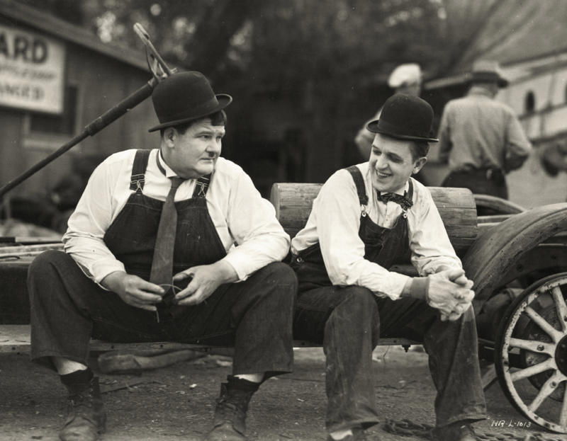 20. Stan Laurel and Oliver Hardy taking a break from filming, 1932 1. A World War Veteran, 1932, 2. Jean Bugatti standing next to his Bugatti Royale, one of the seven he built, 1932, 3. This milkmaid is trying to get the pig off the road, Norway, 1932, 4. Joan Crawford, 1932, 5. Just a young girl and her dog, 1932, 6. Taking a break after their tennis match, Washington DC, 1932, 7. Charles Ebbets shooting his famous photo, Lunch atop a Skyscraper, 1932, 8. Rocking the fur coats and a Cadillac in Harlem, 1932, 9. Painting the Eiffel Tower in 1932, 10. Sitting in peace in NYC, 1932, 11. Driving a dynasphere, 1932, 12. Harpo Marx and Amelia Earhart on the set of Horse Feathers, 1932, 13. Jacob Rheuben Ehrlich (8 ft 6 in) walking the Chicago streets with kids, 1932, 14. Sitting on a truck, playing her guitar in Amarillo, Texas, 1932, 15. A family portrait in Poland, 1932, 16. A colorized portrait of Amelia Earhart, 1932, 17. A woman bringing her pet cat to have a cup of tea, 18. Charles C. Ebbets snapping photos on a skyscraper, 1932, 19. Young Love, 1932, 20. Stan Laurel and Oliver Hardy taking a break from filming, 1932, 21. Fighting their way through the snow, 1932, 22. Taking an extremely unsafe nap, 1932, 23. Street fashion in Japan, 1932, 24. This is what packing for a camping trip looked like in 1932