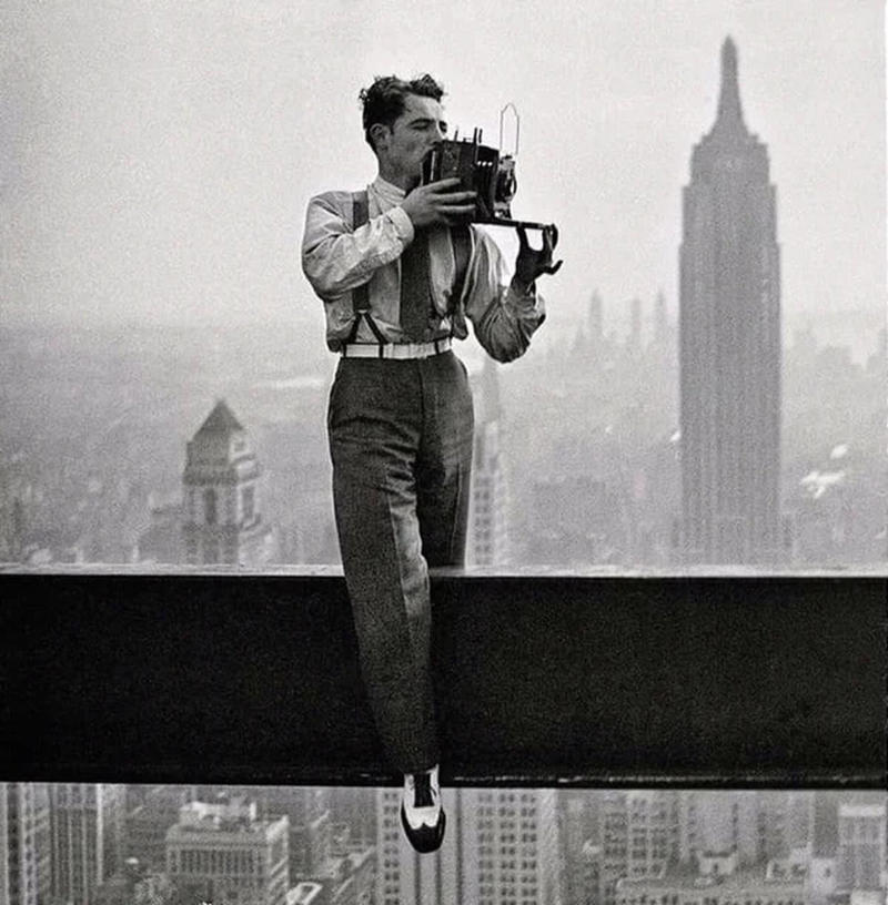 18. Charles C. Ebbets snapping photos on a skyscraper, 1932 1. A World War Veteran, 1932, 2. Jean Bugatti standing next to his Bugatti Royale, one of the seven he built, 1932, 3. This milkmaid is trying to get the pig off the road, Norway, 1932, 4. Joan Crawford, 1932, 5. Just a young girl and her dog, 1932, 6. Taking a break after their tennis match, Washington DC, 1932, 7. Charles Ebbets shooting his famous photo, Lunch atop a Skyscraper, 1932, 8. Rocking the fur coats and a Cadillac in Harlem, 1932, 9. Painting the Eiffel Tower in 1932, 10. Sitting in peace in NYC, 1932, 11. Driving a dynasphere, 1932, 12. Harpo Marx and Amelia Earhart on the set of Horse Feathers, 1932, 13. Jacob Rheuben Ehrlich (8 ft 6 in) walking the Chicago streets with kids, 1932, 14. Sitting on a truck, playing her guitar in Amarillo, Texas, 1932, 15. A family portrait in Poland, 1932, 16. A colorized portrait of Amelia Earhart, 1932, 17. A woman bringing her pet cat to have a cup of tea, 18. Charles C. Ebbets snapping photos on a skyscraper, 1932, 19. Young Love, 1932, 20. Stan Laurel and Oliver Hardy taking a break from filming, 1932, 21. Fighting their way through the snow, 1932, 22. Taking an extremely unsafe nap, 1932, 23. Street fashion in Japan, 1932, 24. This is what packing for a camping trip looked like in 1932