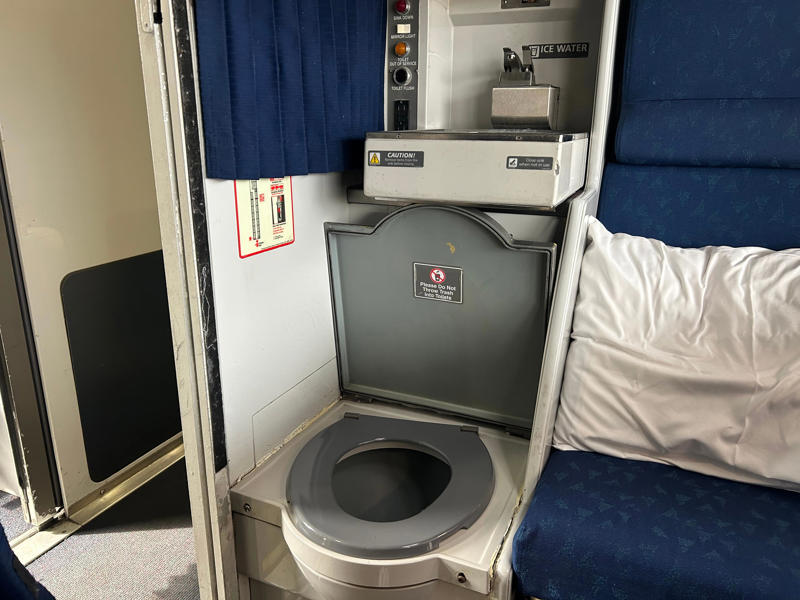 Unfortunately, my first-class journey began with a five-hour delay., Once my train finally arrived, I got to board early., A dedicated attendant guided me down the slim walkways to my room., The upper level featured a comfortable bed., The upper bed had its own storage space and viewing window., The dining car felt like a fine-dining experience ..., After a long day, the bed in the roomette was a godsend., Finally, I arrived at my destination six hours after the scheduled time.