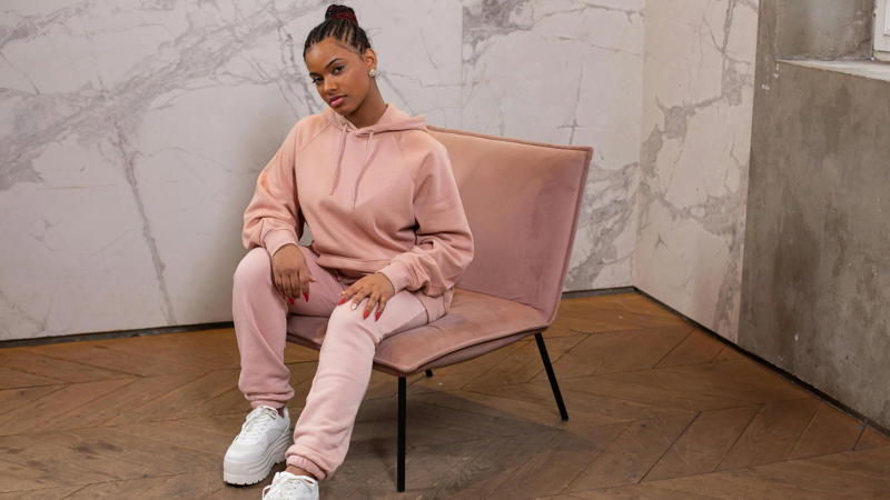 1. Matching Sweat Set With Sneakers, 2. Linen Pants And A Ribbed Tank, 3. Oversized Hoodie And Biker Shorts, 4. Monochrome Tracksuit With Gold Accessories, 5. Cropped Sweatshirt And Wide-Leg Trousers, 6. Flowy Jumpsuit With A Denim Jacket, 7. Matching Knit Set In Earth Tones, 8. Black Leggings And Oversized Flannel, 9. Button-Up Shirt Dress With A Crossbody, 10. Silk Pajama Set With Loafers, 11. Cropped Puffer And Cargo Pants, 12. Romper With A Lightweight Scarf, 13. Cardigan Over A T-Shirt Dress, 14. Faux Leather Joggers And A Soft Tee, 15. Coordinated Athleisure Set With Cap, 16. Knit Maxi Dress And Sneakers, 17. Denim Overalls And A Striped Tee, 18. Layered Tank, Shirt &amp; Joggers, 19. Cotton Turtleneck And Pleated Skirt, 20. Hoodie Dress And High Socks