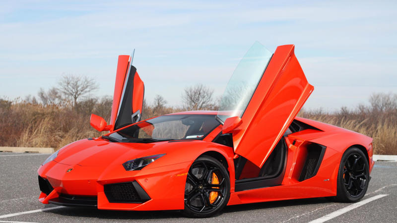 1. Ferrari, 2. Porsche, 3. Bentley, 4. Lamborghini, 5. Rolls-Royce, 6. Aston Martin, 7. McLaren, 8. Maserati, 9. Mercedes-Benz, 10. Bugatti Chiron, 11. Land Rover, 12. Lincoln, 14. Audi, 15. Tesla, 16. Koenigsegg, 17. Pagani, 18. Lexus, 19. Genesis, 20. Alfa Romeo