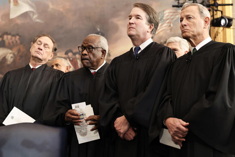 Supreme Court Justices at Trump’s inauguration Graduate wearing MAGA hat at commencement, Trump merchandise at Iowa State Fairgrounds, MAGA Nation event with Trump supporters, Justice Clarence Thomas at inauguration ceremony, Supreme Court justices at Sandra Day O’Connor ceremony, Supreme Court Justices at Trump’s inauguration, The Supreme Court Justices lineup