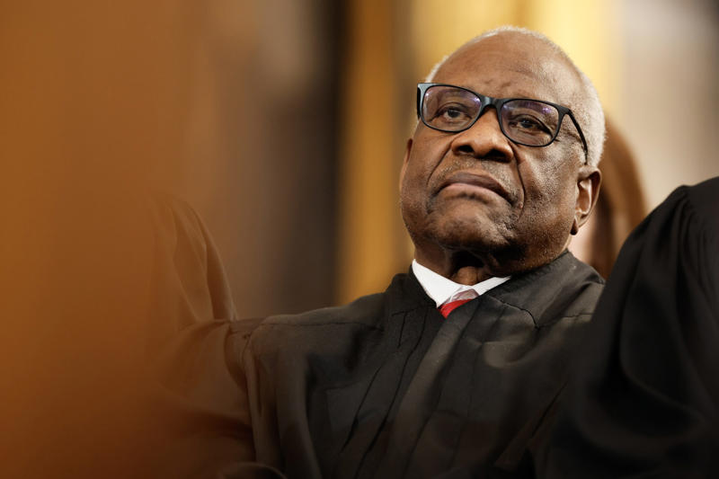 Justice Clarence Thomas at inauguration ceremony Graduate wearing MAGA hat at commencement, Trump merchandise at Iowa State Fairgrounds, MAGA Nation event with Trump supporters, Justice Clarence Thomas at inauguration ceremony, Supreme Court justices at Sandra Day O’Connor ceremony, Supreme Court Justices at Trump’s inauguration, The Supreme Court Justices lineup