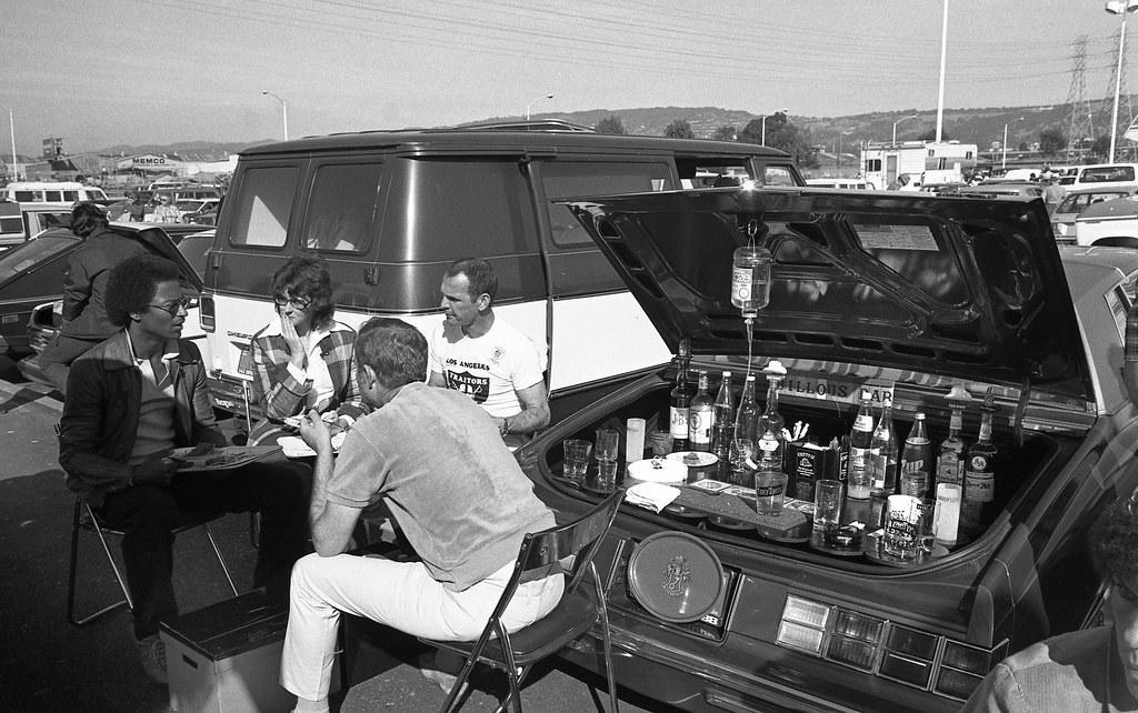 1. Pregaming Before ‘The Who’ Concert in Pittsburgh (Early 1980s), 2. Tailgating in a Full Suit at a Packers Game (Late 1970s), 3. Creatively Catching the All-Star Game in San Diego (1992), 4. Getting Hyped for Wrestlemania (1987), 5. New York Cosmos Fans Tailgating at Giants Stadium (1970s), 6. Tailgating at a ‘Genesis’ Concert, 7. Ringing in the Raiders’ Season Opener (1984), 8. Grilling at Milwaukee’s County Stadium (1977), 9. Throwing ‘Em Back at the Philadelphia Eagles Game (1983), 10. Tailgating at Shea Stadium After the Mets Won the World Series (1986), 11. Tailgating After a Dirt Bike Race Out in the Boondocks (1970s), 12. Tailgate Keg (1950s), 13. Going All Out for the Browns vs. Oilers Game (1988), 14. The Country Squire Was the Ultimate Picnic Ride (1960), 15. The Classiest Tailgate (1954), 16. There’s a Full Bar in the Trunk … (1980)
