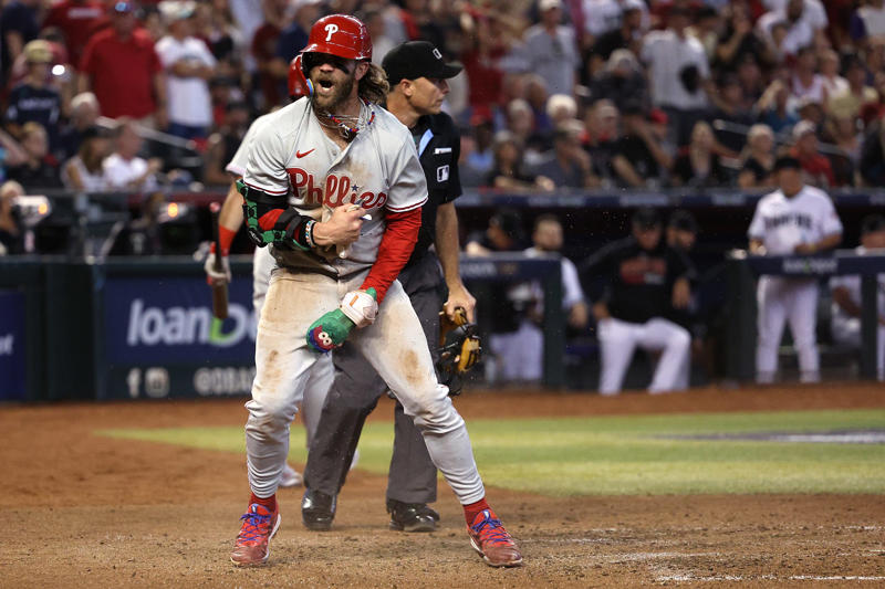 Manager: Charlie Manuel, Starting pitcher: Steve Carlton, Reliever/closer: Tug McGraw, Catcher: Darren Daulton, 1B: Ryan Howard, 2B: Chase Utley, 3B: Mike Schmidt, SS: Jimmy Rollins, OF: Bobby Abreu, OF: Lenny Dykstra, OF: Richie Ashburn, DH: Bryce Harper, Honorable mentions: