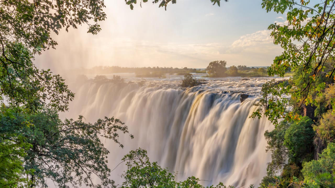 7. VICTORIA FALLS, ZAMBI: Known as “The Smoke That Thunders,” Victoria Falls is one of the largest and most spectacular waterfalls on Earth. During the rainy season, the sheer volume of water creates a mist that can be seen from miles away, adding to the wonder of this natural marvel. 1. SANTORINI, GREECE: Famous for its whitewashed buildings and cerulean-domed churches, Santorini offers one of the most iconic sunsets in the world. Perched on volcanic cliffs overlooking the Aegean Sea, Oia village becomes a golden dream as the sun dips below the horizon. It’s no wonder this island is a top romantic getaway., 2. BANFF NATIONAL PARK, CANADA: Nestled in the Canadian Rockies, Banff National Park is a paradise for nature lovers. The turquoise waters of Lake Louise and Moraine Lake, surrounded by snow-capped peaks and alpine forests, offer picture-perfect scenery in every season., 3. MACHU PICCHU, PERU: One of the Seven Wonders of the World, Machu Picchu sits 7,970 feet above sea level in the Andes Mountains. The ancient Incan city is shrouded in mist and mystery, offering panoramic views of lush green peaks and dramatic valleys that leave travelers in awe., 4. THE GRAND CANYON, USA: A UNESCO World Heritage Site, the Grand Canyon is a geological marvel carved by the Colorado River over millions of years. Its layered red rock formations and expansive vistas are best viewed from the South Rim or via a scenic helicopter tour., 5. FIORDLAND NATIONAL PARK, NEW ZEALAND: Home to the stunning Milford Sound, Fiordland is a pristine wilderness of dramatic fjords, waterfalls, and towering cliffs. Whether you explore it by boat, kayak, or hiking trail, every angle reveals a new jaw-dropping view., 6. TROLLTUNGA, NORWAY: This epic cliff jutting out over a stunning lake in Norway offers one of the most adventurous viewpoints in the world. After a challenging hike, you’re rewarded with panoramic views of snow-covered mountains and deep blue fjords that stretch for miles., 7. VICTORIA FALLS, ZAMBI: Known as “The Smoke That Thunders,” Victoria Falls is one of the largest and most spectacular waterfalls on Earth. During the rainy season, the sheer volume of water creates a mist that can be seen from miles away, adding to the wonder of this natural marvel., 8. PETRA, JORDAN: Carved into rose-colored rock, Petra is an archaeological wonder and a photographer’s dream. The sight of the Treasury emerging from narrow sandstone canyons (Siq) is nothing short of breathtaking, especially at sunrise or by candlelight during Petra by Night., 9. MOUNT EVEREST BASE CAMP, NEPAL: For trekkers and climbers, the journey to Everest Base Camp is as rewarding as the destination itself. Surrounded by the towering Himalayas and colorful prayer flags fluttering in the wind, the views are both humbling and spiritually uplifting., 10. ANTELOPE CANYON, USA: Located in Arizona, Antelope Canyon is a slot canyon known for its smooth, wave-like sandstone walls. When sunlight beams down into the narrow crevices, it creates an ethereal play of light and shadow that feels like stepping into another world.