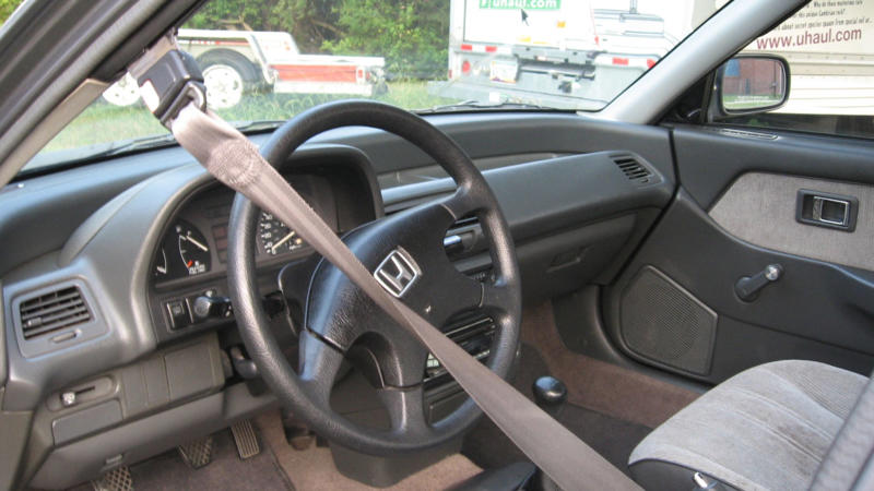 Automatic Seatbelts Best And Worst Car Trends, Automatic Seatbelts, Touchscreen-Only Controls, Pop-Up Headlights, Faux Engine Sounds Through The Speakers, Built-In Navigation Systems That Aged Terribly, Rear-Mounted Spare Tires On Compact Cars, Plastic Wood Grain Interior Trim, Push-Button Transmissions, Gimmicky Gullwing Doors On Everyday Models, Built-In DVD Players In The Age Of Tablets, Retractable Hardtops, Overly Sensitive Lane Departure Warnings, Apple CarPlay And Android Auto Integration, Hybrid Powertrains, Heads-Up Displays, Heated And Ventilated Seats, Lane-Keeping Assist, Keyless Entry And Push-To-Start, Parking Sensors, Wireless Charging Pads, Automatic Rain-Sensing Wipers, Hands-Free Liftgates, Blind Spot Monitoring