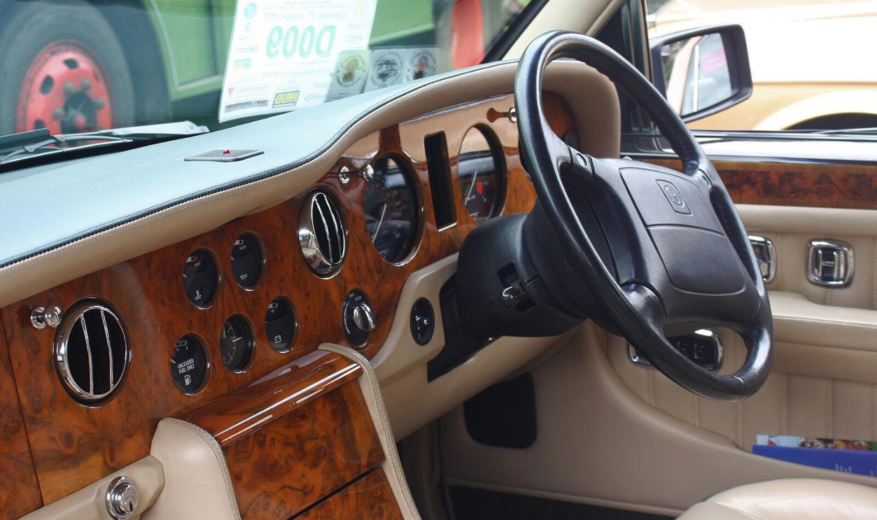 Plastic Wood Grain Interior Trim Best And Worst Car Trends, Automatic Seatbelts, Touchscreen-Only Controls, Pop-Up Headlights, Faux Engine Sounds Through The Speakers, Built-In Navigation Systems That Aged Terribly, Rear-Mounted Spare Tires On Compact Cars, Plastic Wood Grain Interior Trim, Push-Button Transmissions, Gimmicky Gullwing Doors On Everyday Models, Built-In DVD Players In The Age Of Tablets, Retractable Hardtops, Overly Sensitive Lane Departure Warnings, Apple CarPlay And Android Auto Integration, Hybrid Powertrains, Heads-Up Displays, Heated And Ventilated Seats, Lane-Keeping Assist, Keyless Entry And Push-To-Start, Parking Sensors, Wireless Charging Pads, Automatic Rain-Sensing Wipers, Hands-Free Liftgates, Blind Spot Monitoring
