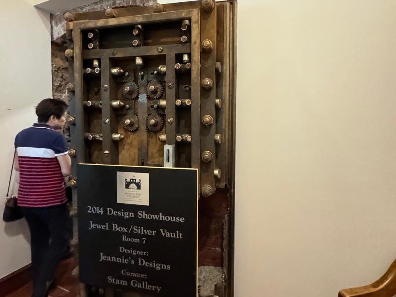 This is the door to the silver safe. When the US Navy vacated the home in 1967, they sealed it up, and it was only rediscovered in 2014. It also features the largest fireplace in the home., The billiards room also has a luxurious window seat., Directly next to the breakfast room was another wood-paneled study., It has yet another perfect window seat., It's also one of the only rooms with a private bathroom., We stopped at one more guest room, which was more modest., As the tour concluded, we were able to explore the gardens outside.