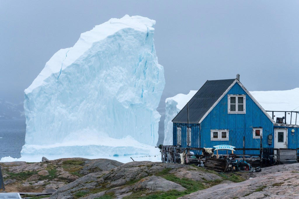 Incredible photos show huge iceberg drifting dangerously close to shore