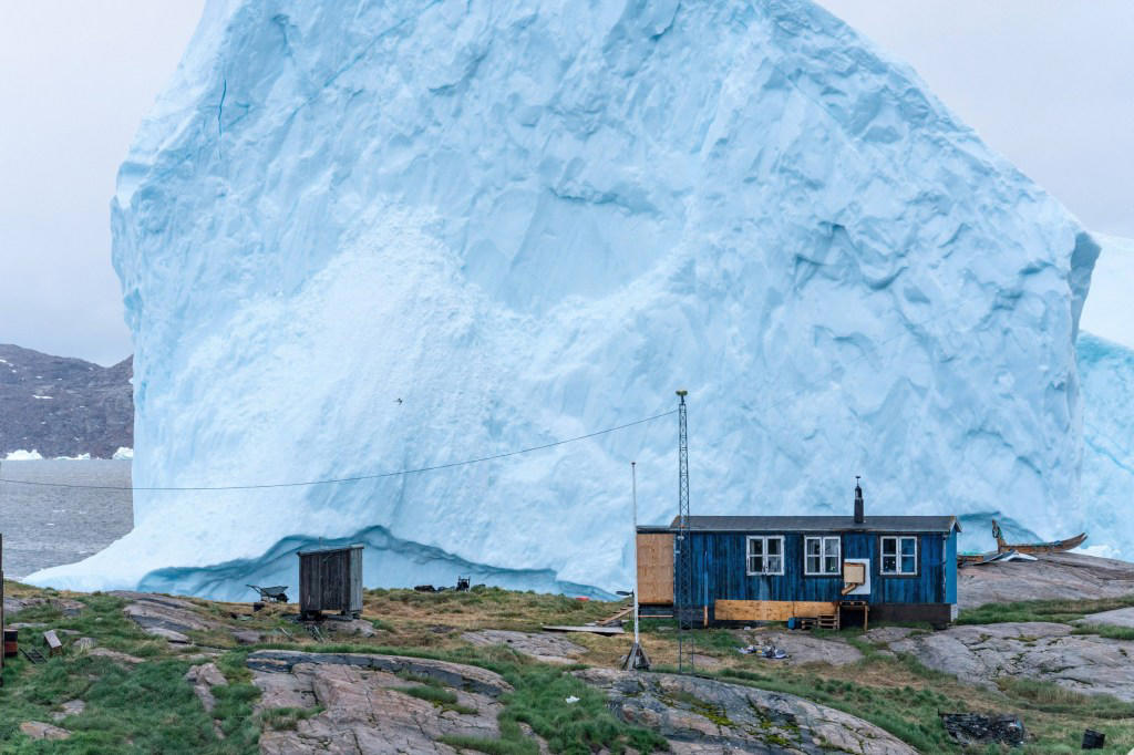 Incredible photos show huge iceberg drifting dangerously close to shore